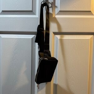 Brand new black crossbody or waist bag. Two zippered compartments. Never used